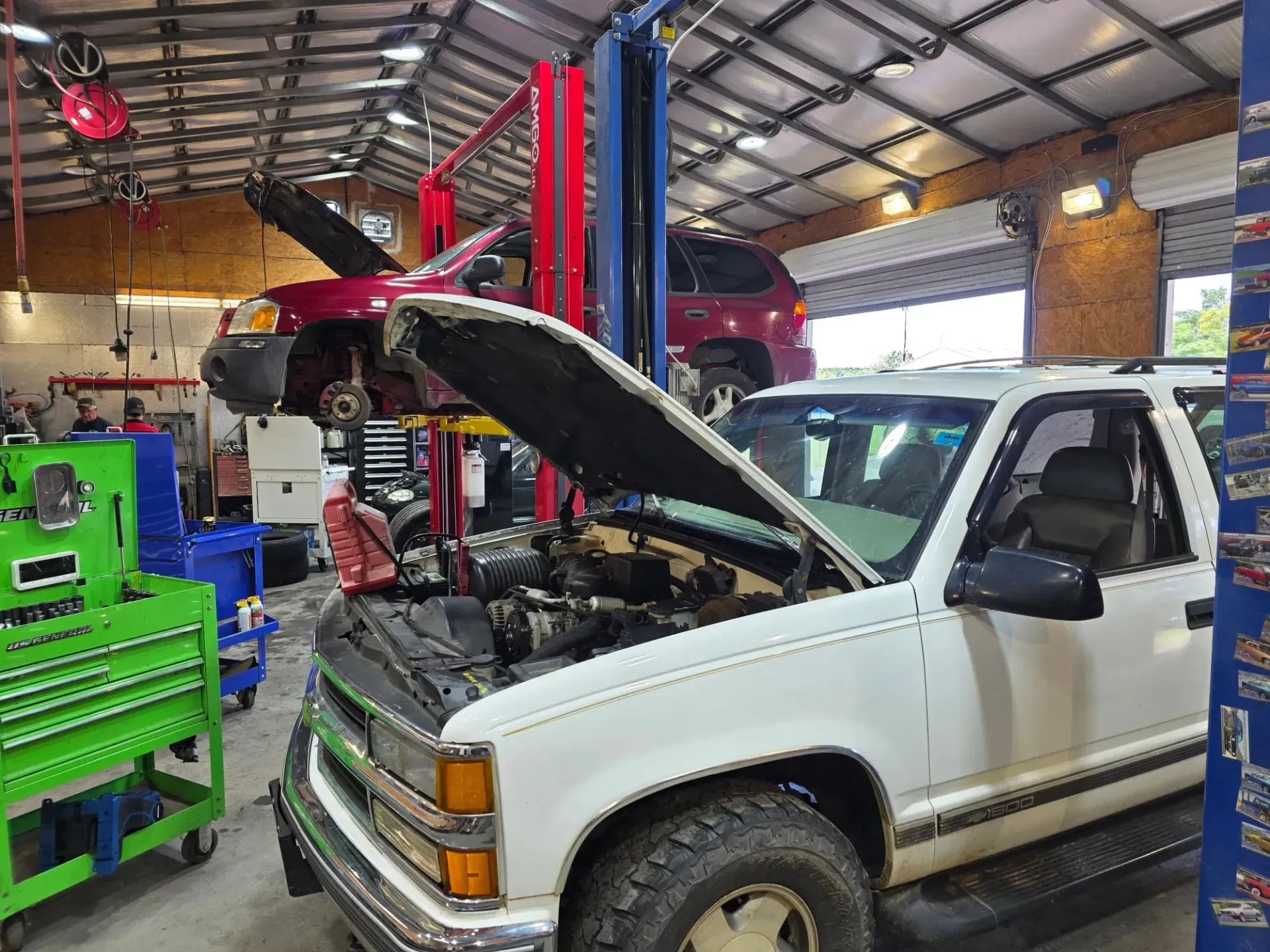 White Pickup Truck with Hood Open in Auto Repair Shop | Masters Auto Group
