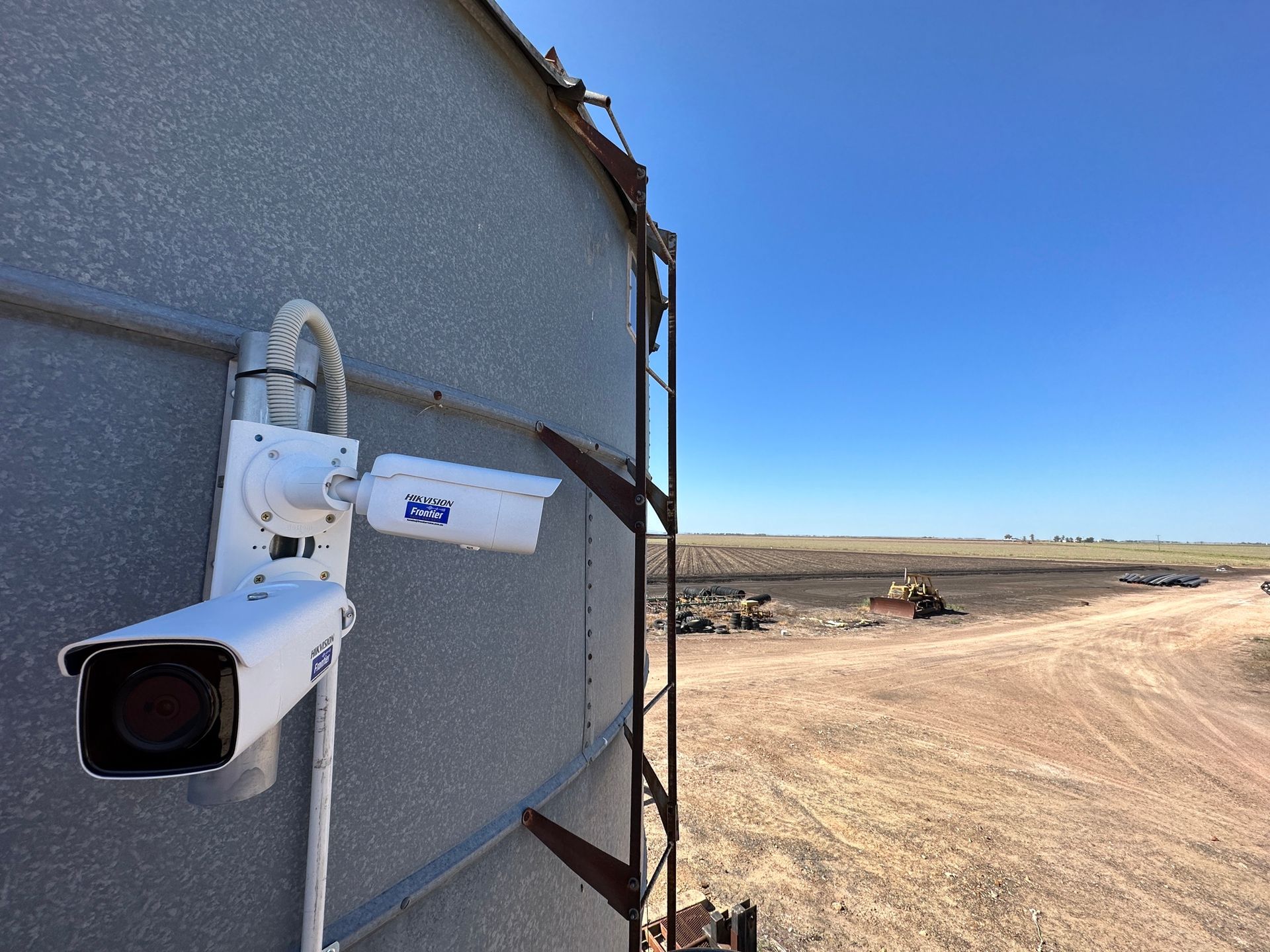 Two Security Cameras Mounted on a Metal Silo — Frontier Security in Warwick, QLD 