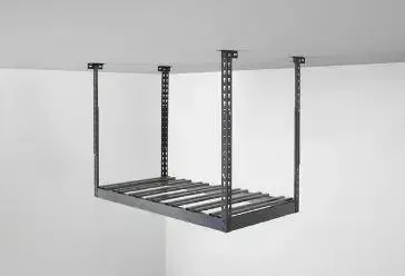 a garage ovehead rack is hanging from the ceiling in a garage .