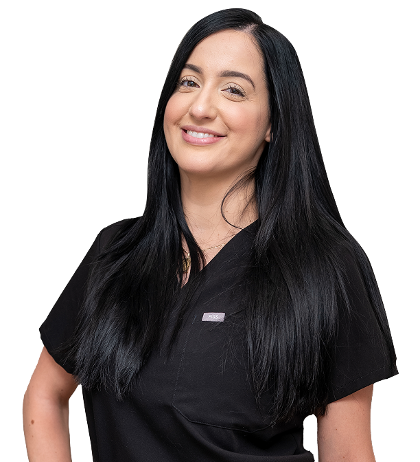 Woman with long black hair, smiling, wearing black scrubs.