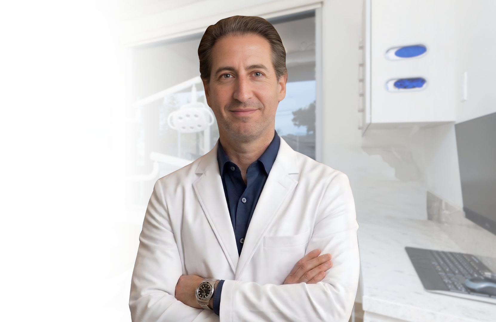 Doctor in a white coat standing with arms crossed in a bright modern clinic office.