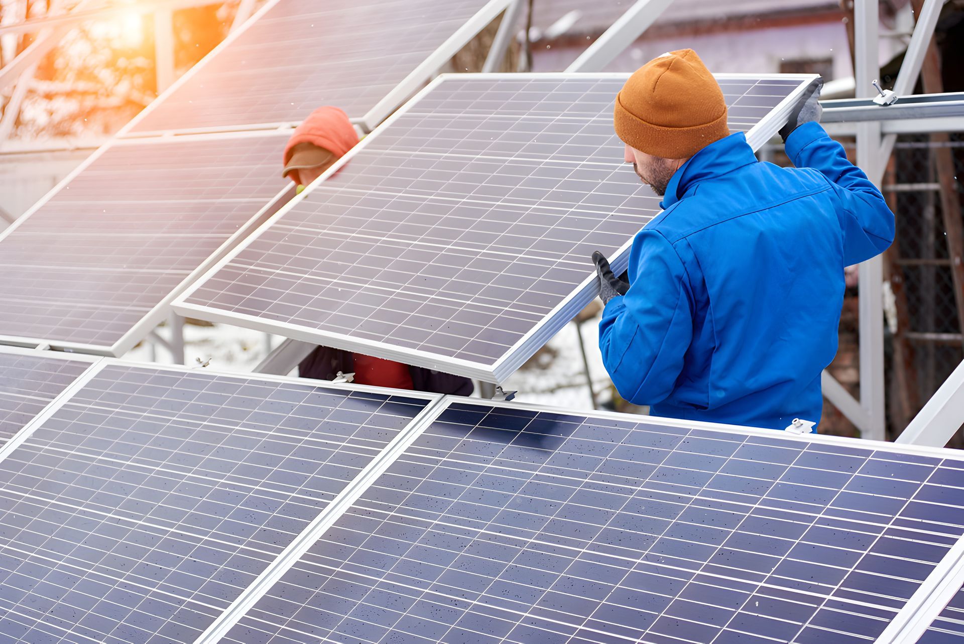 Two Men Fixing Solar Panel — Max Fox Electrical in Narrabri, NSW