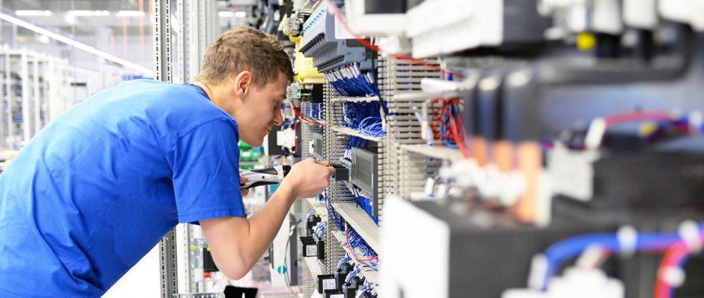 Working On A Machine In A Factory — Max Fox Electrical in Narrabri, NSW