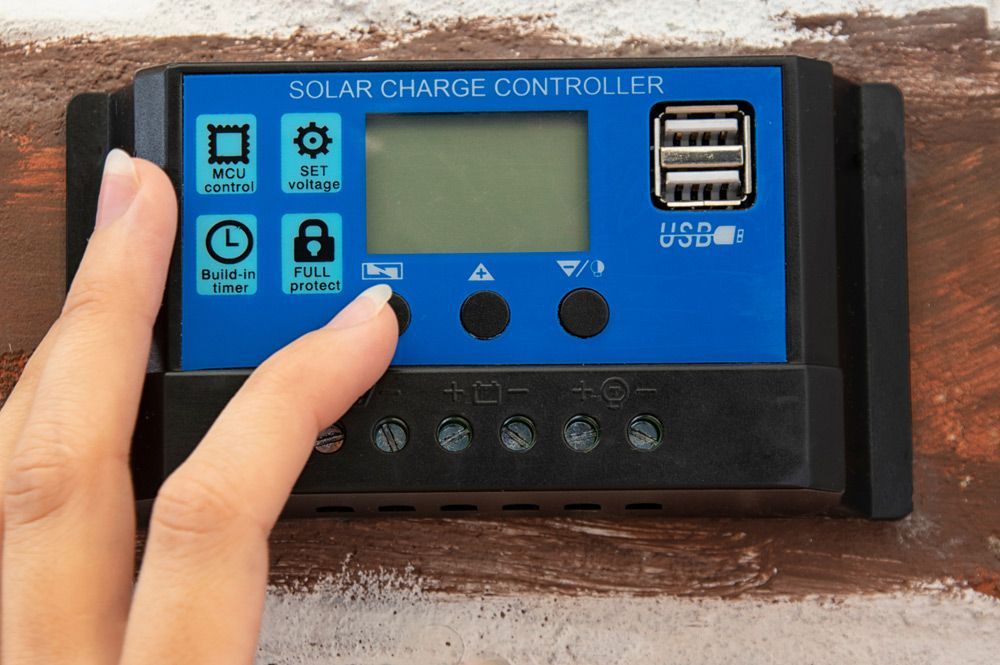 Pressing A Button On A Solar Charge Controller — Max Fox Electrical in Armidale, NSW