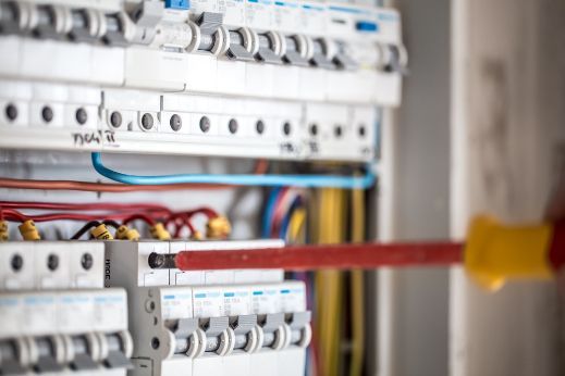 Using A Screwdriver To Fix An Electrical Box — Max Fox Electrical in Armidale, NSW