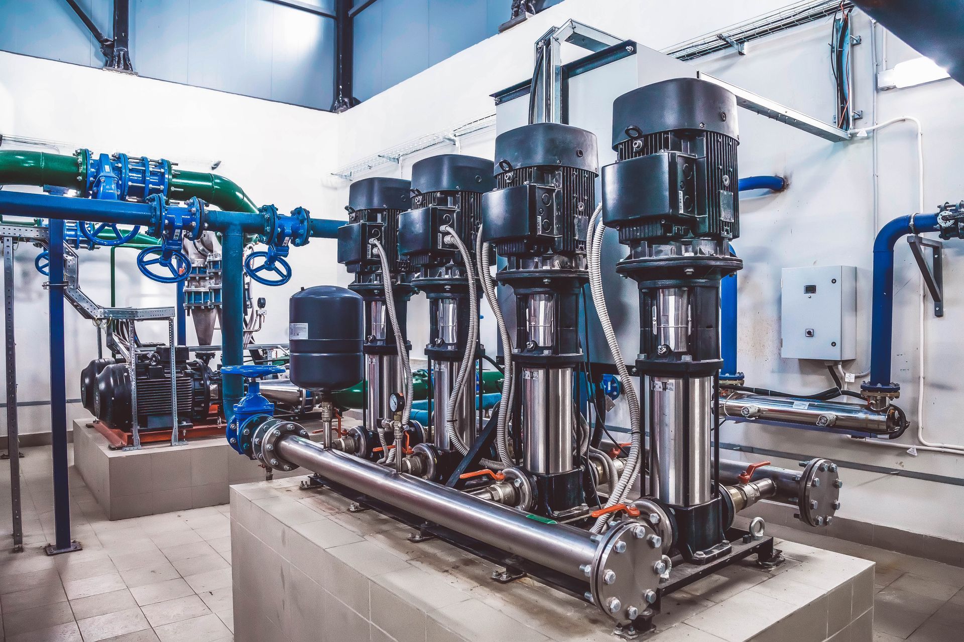 Industrial Pump and Piping System in a Bright Mechanical Room — Max Fox Electrical in Gunnedah, NSW