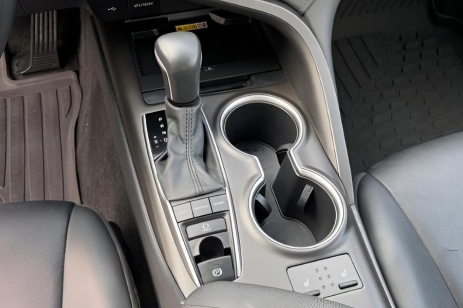 Two car dashboards side-by-side: clean and dirty. Black infotainment screens, buttons, gear shifts, and cup holders.