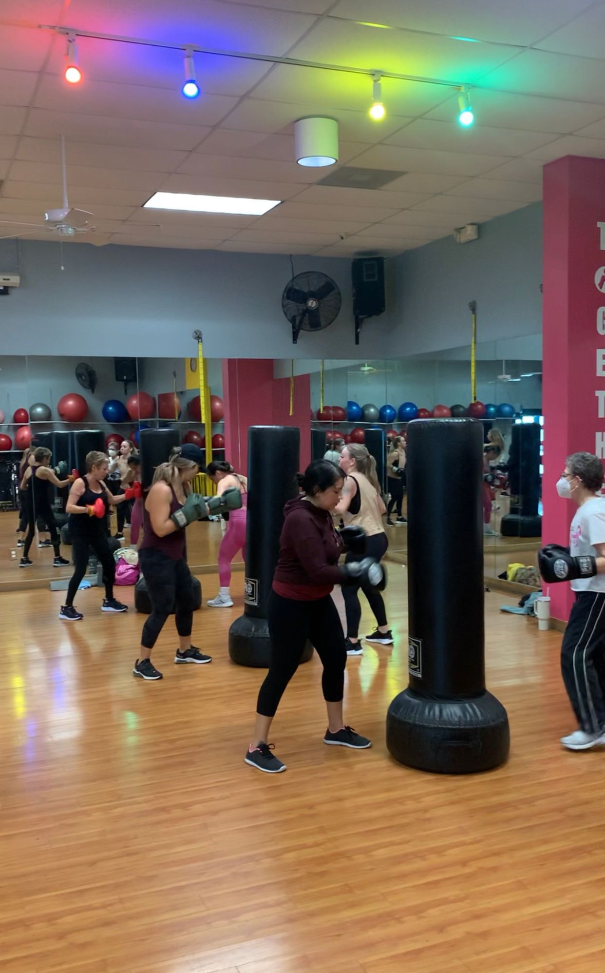 A group of people are boxing in a gym.