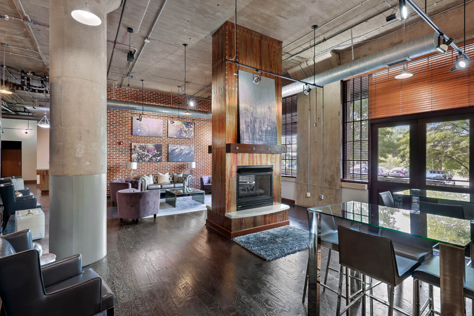 There is a fireplace in the middle of the clubhouse.