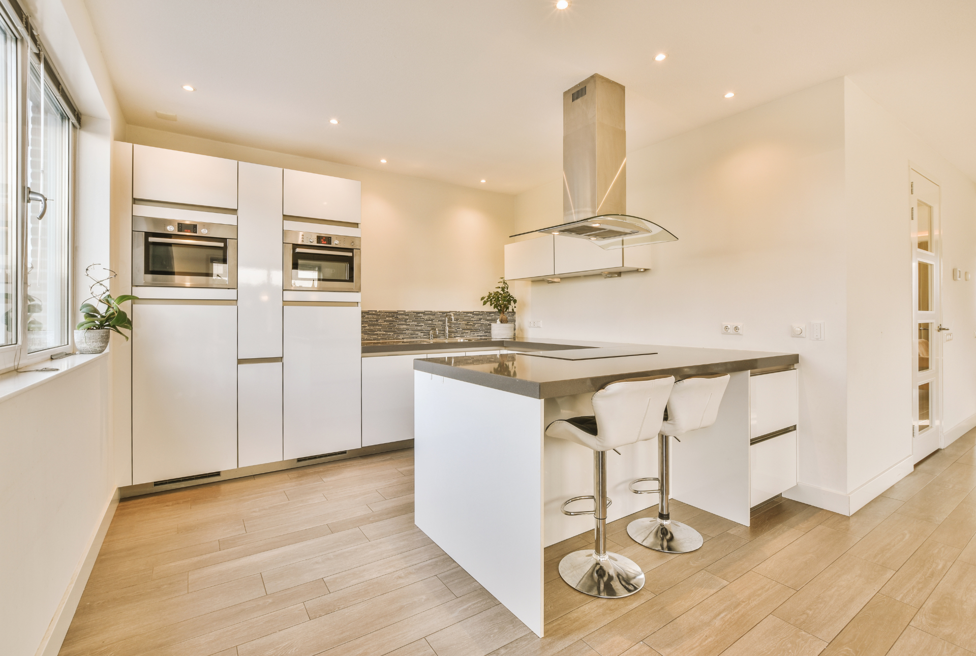 vinyl plank flooring in a basement kitchen area