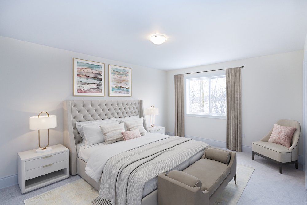 A bedroom with a large bed , chair , nightstand , and window.