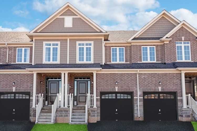A row of brick houses with garages and stairs