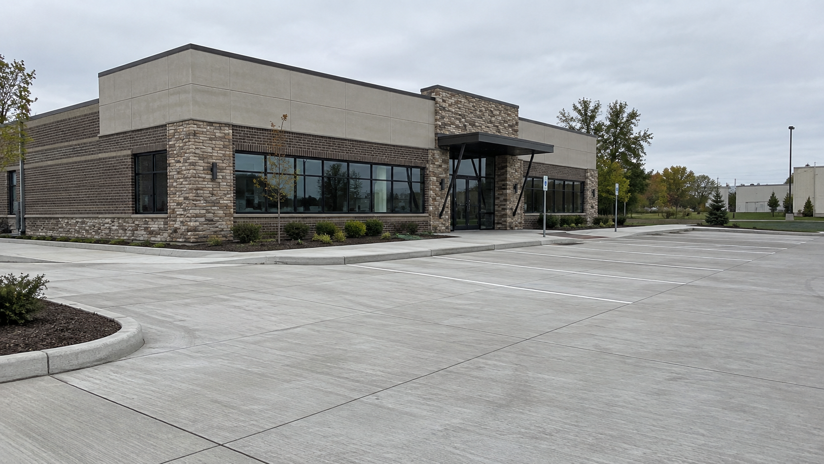 Empty commercial building and parking lot on an overcast day