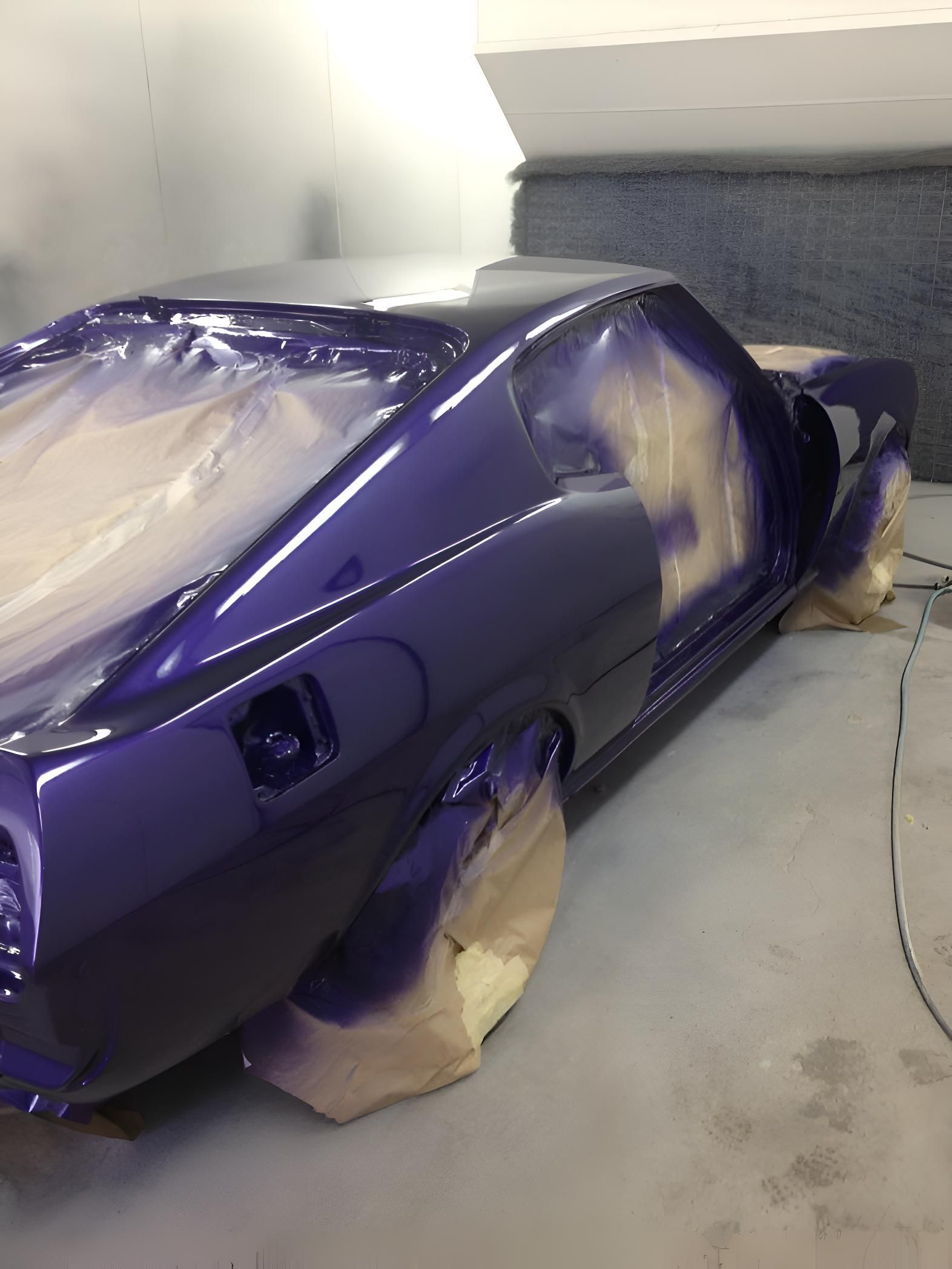 A Purple Car Is Being Painted In A Garage — P & V Panel Works In Alice Springs, NT