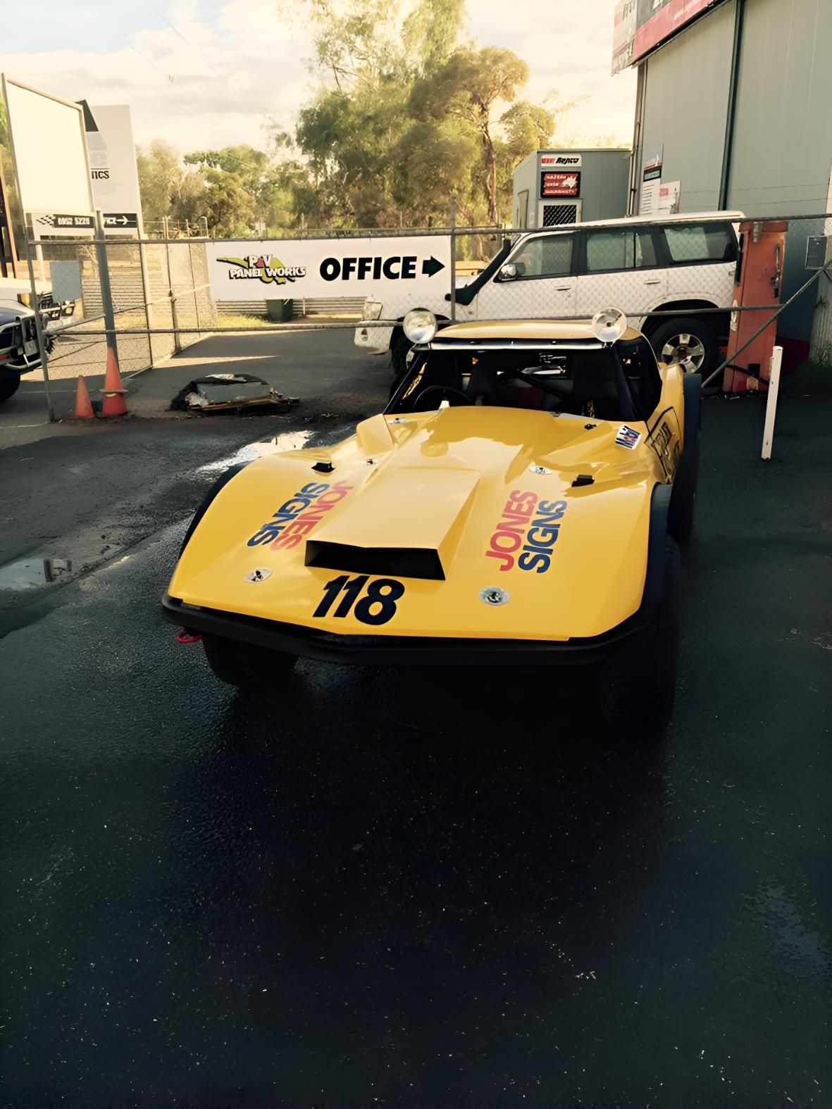 A Yellow Race Car With The Number 118 On It — P & V Panel Works In Alice Springs, NT