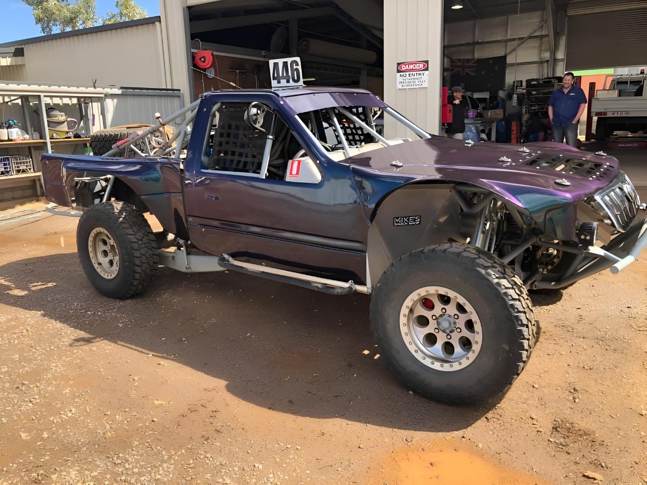 A Purple Truck Is Parked In Front Of A Garage — P & V Panel Works In Alice Springs, NT