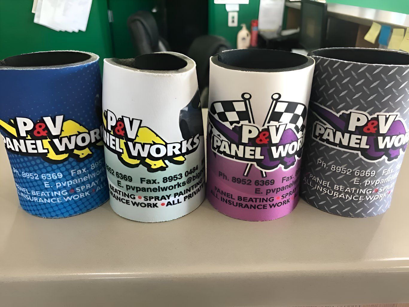 Four Can Coolers With The Words P & V Panel Works — P & V Panel Works In Alice Springs, NT
