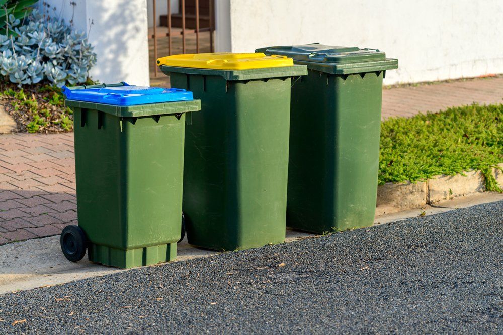 Three Green Trash Bins — Clinton, MO — Golden Valley Disposal LLC