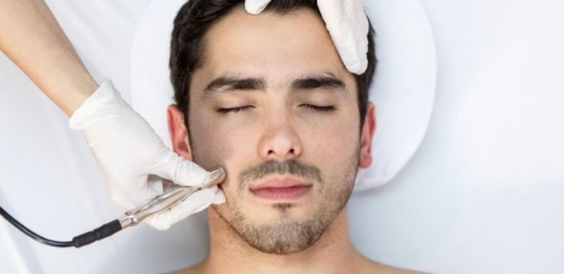 relaxed man receiving microdermabrasion 
