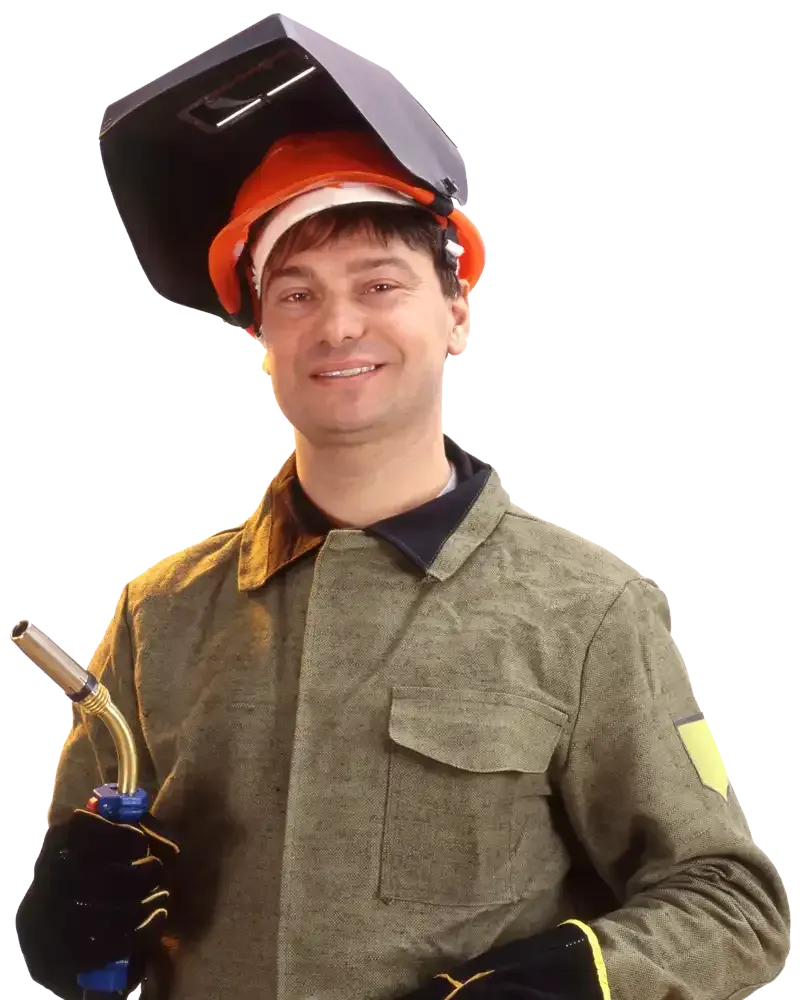 Person wearing a welding helmet and green jacket holds a welding torch on a white background