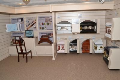 Indoor display of miniature kitchens and appliances in a showroom or museum exhibit
