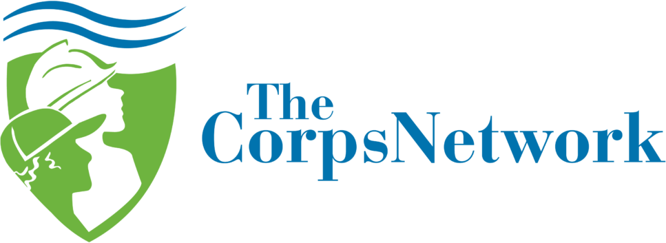 The Corps Network logo. Green shield with silhouettes, blue waves, and the words