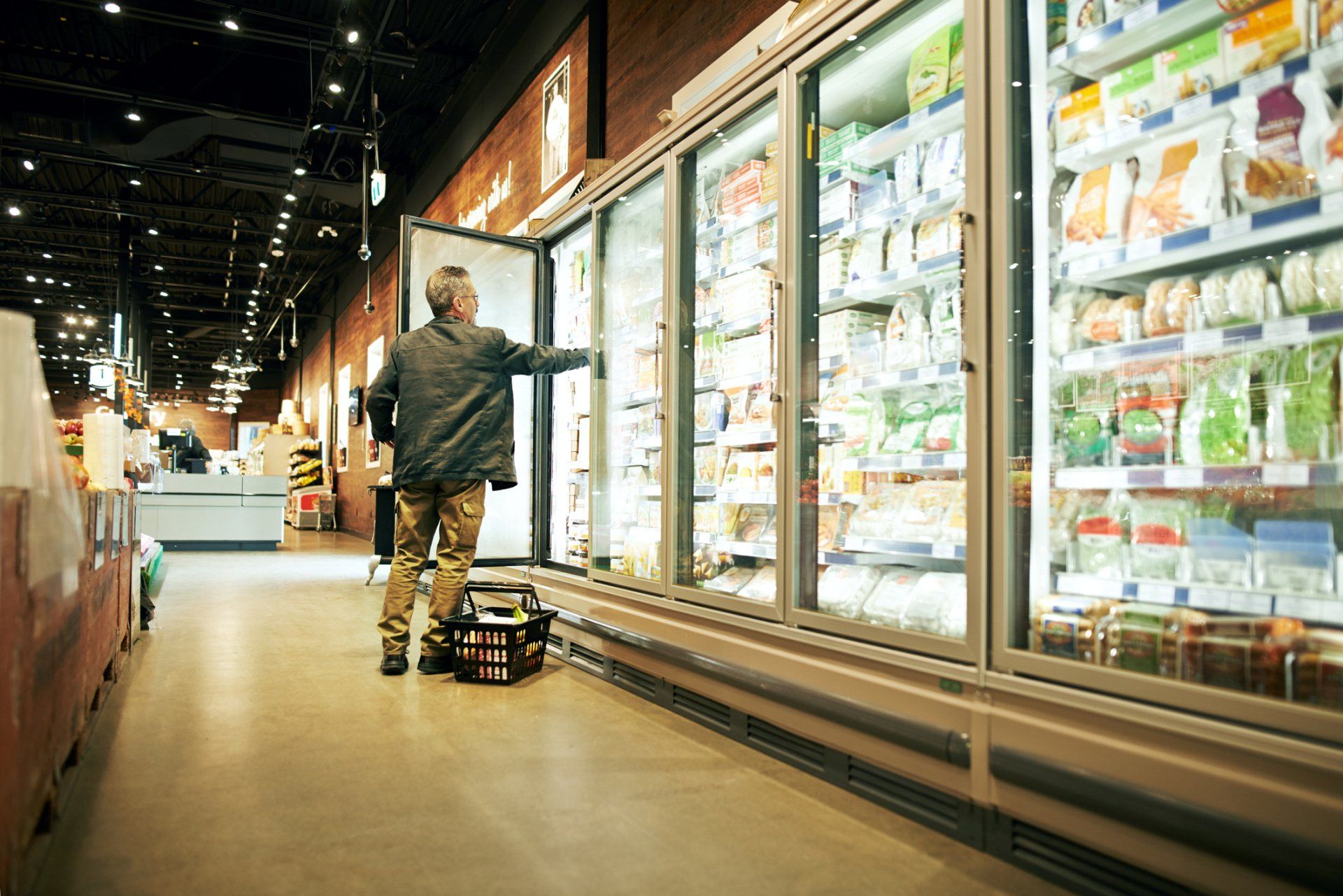 Man Using A Refrigerator — Huntingburg, IN — RG Mechanical Contracting LLC