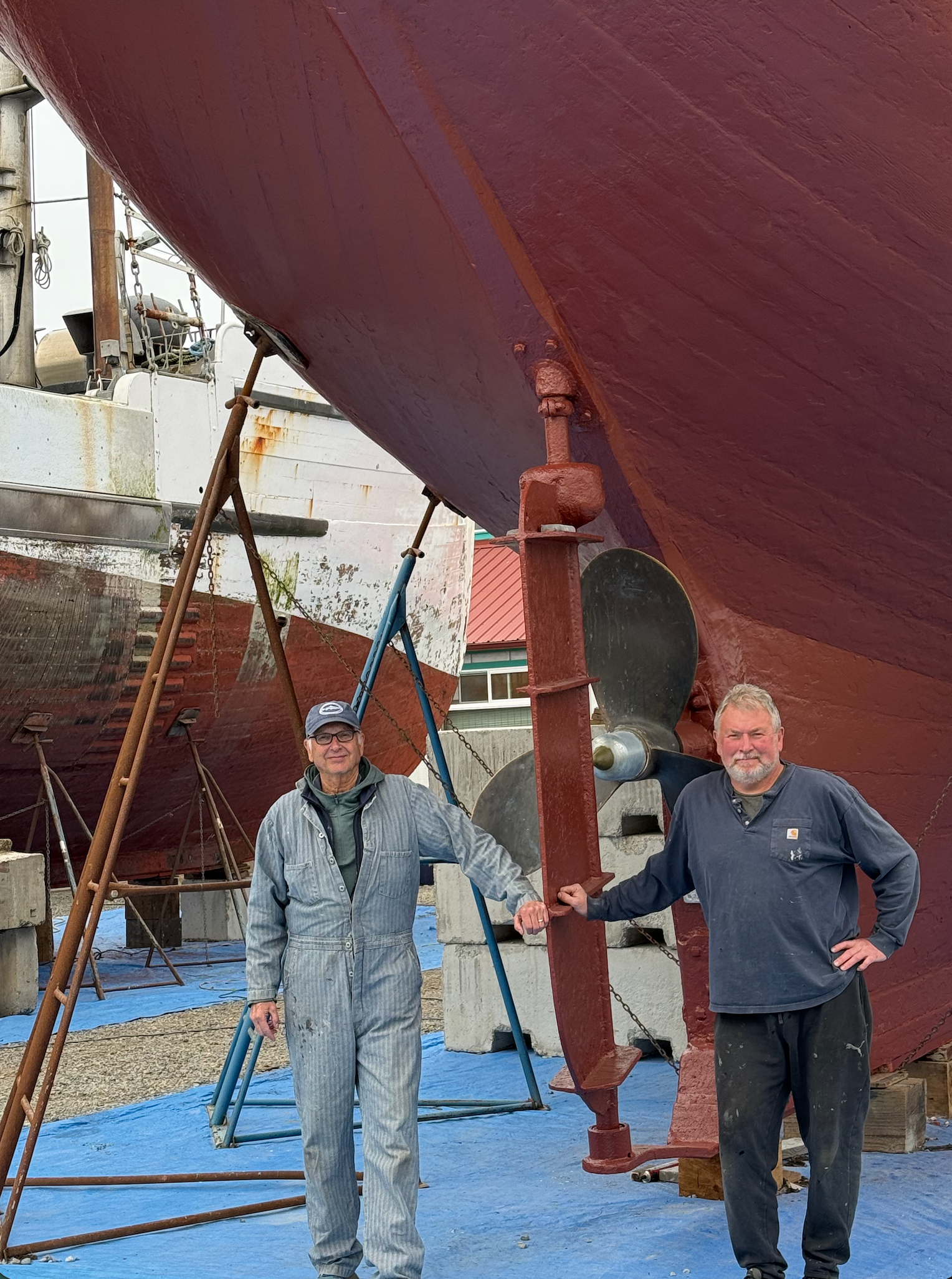Owner John McHenry and captain Pete Lopuszynski beside Seymour's rudder at Port Townsend Shipwrights. 