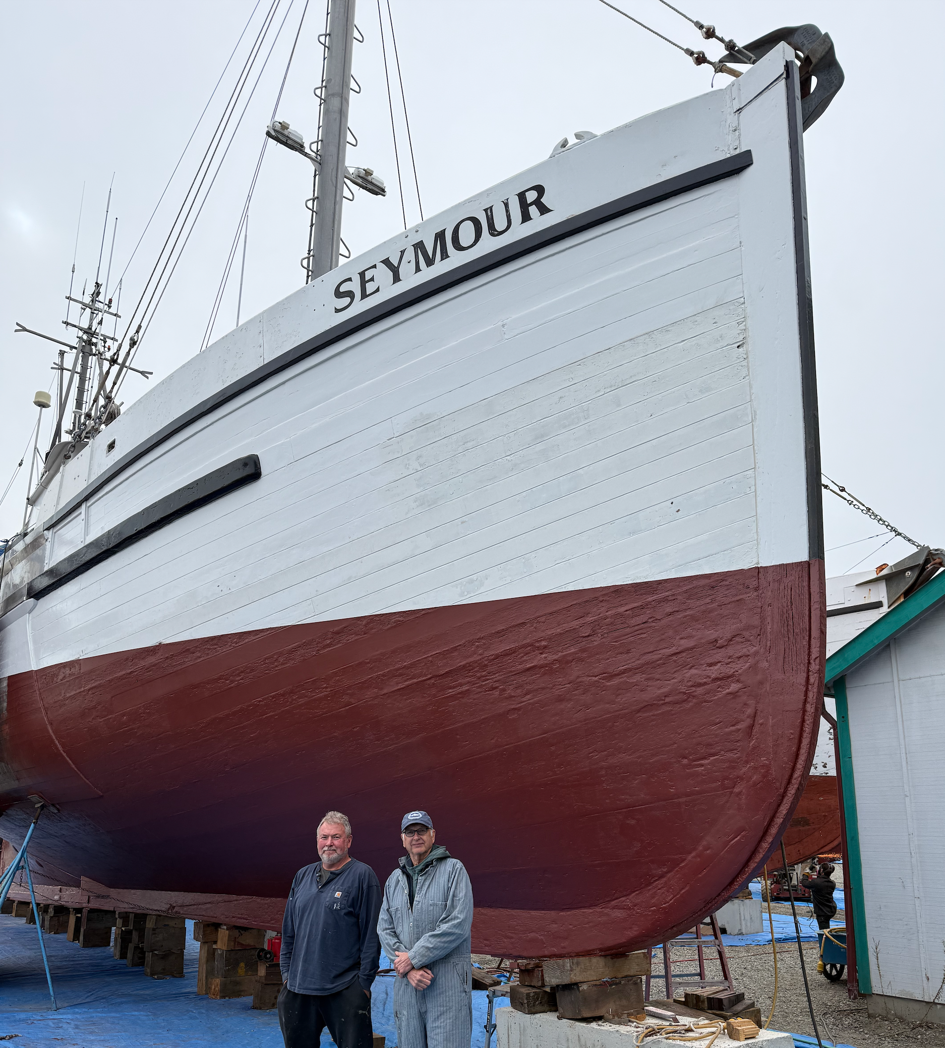 Owner John McHenry and captain Pete Lopuszynski beside Seymour's bow at Port Townsend Shipwrights.