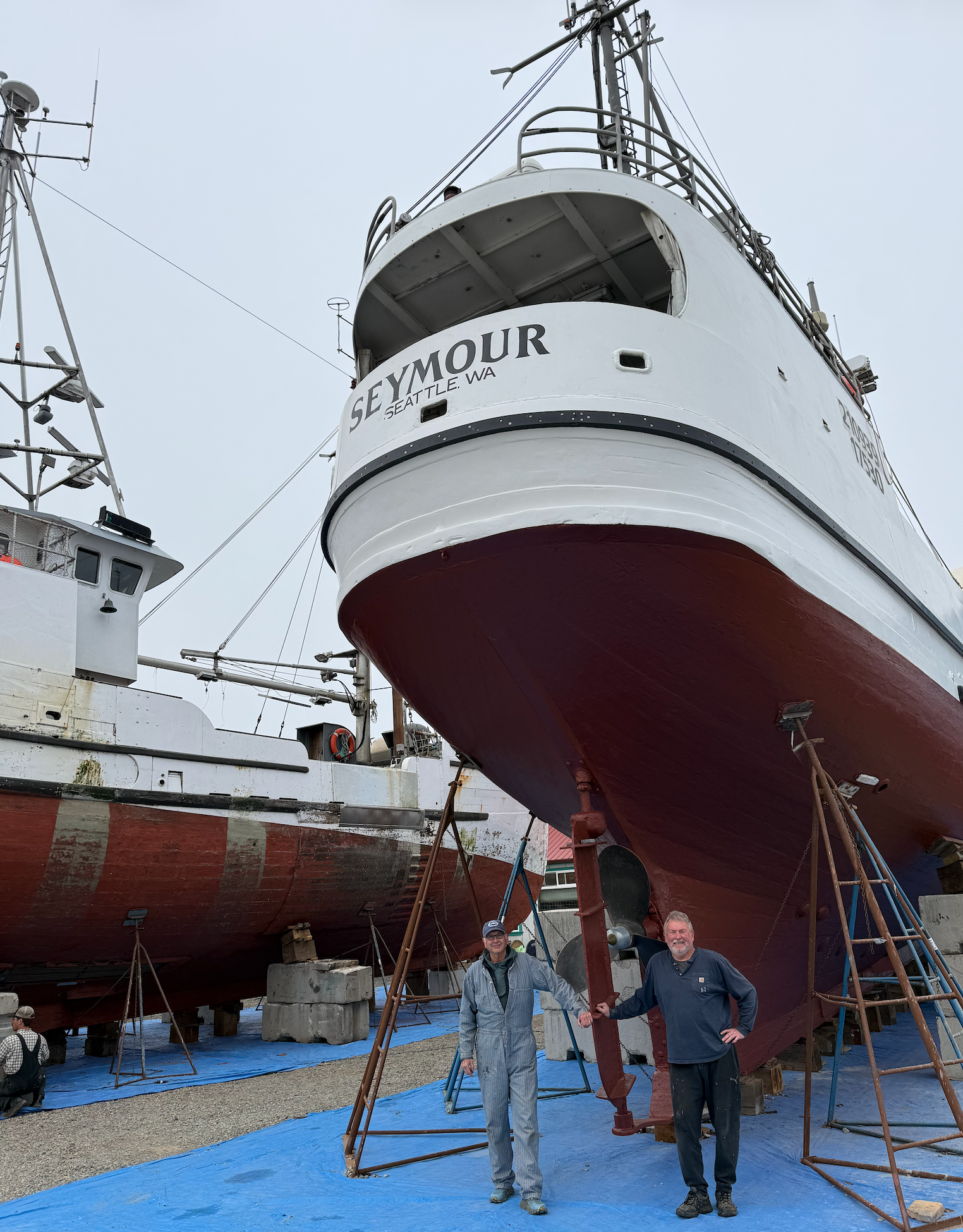 Owner John McHenry and captain Pete Lopuszynski beside Seymour's rudder at Port Townsend Shipwrights.
