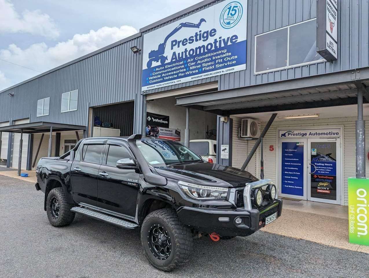 A Black Truck Is Parked In Front Of A Building — Prestige Automotive NT In Yarrawonga, NT