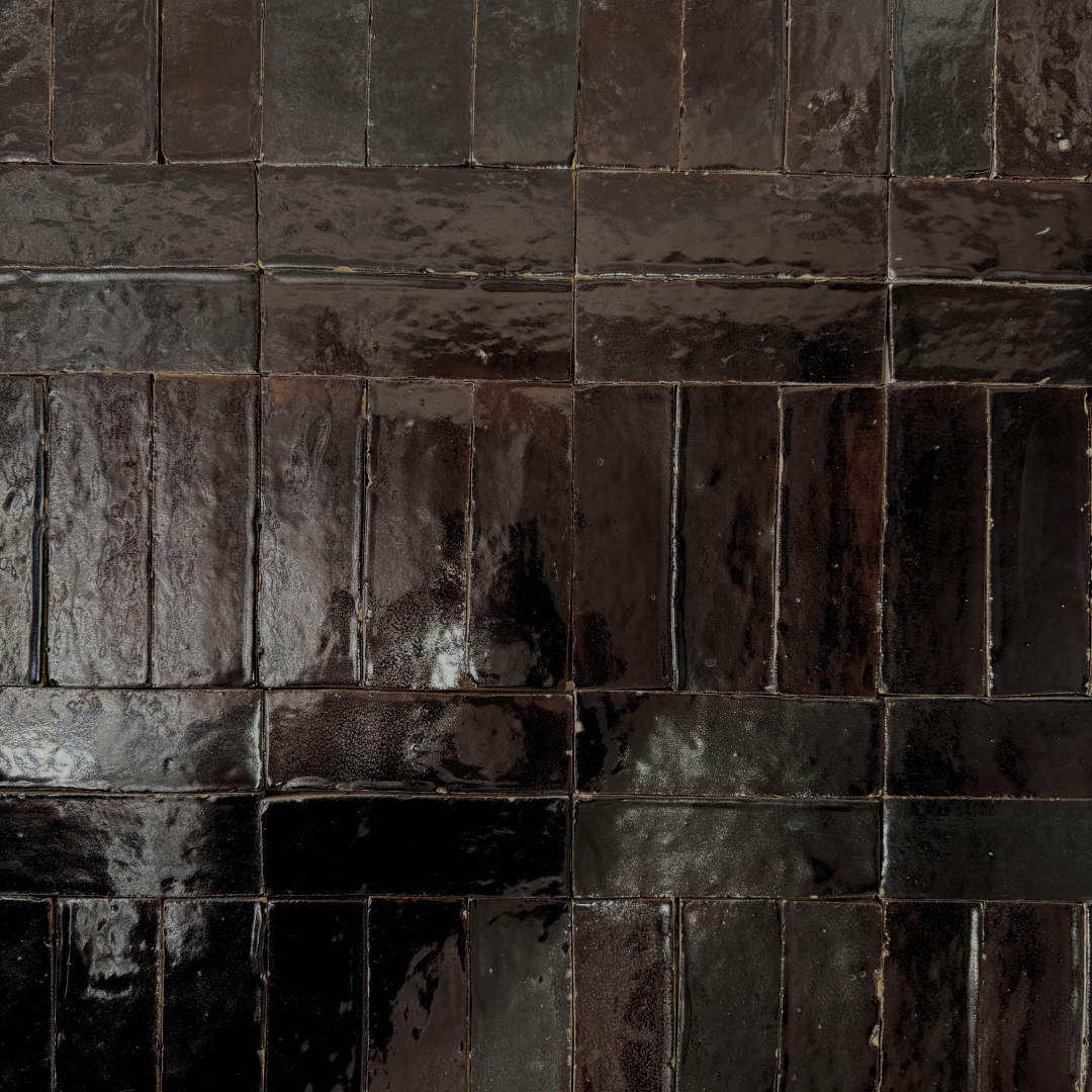 Glossy Black Rectangular Tiles Arranged in a Brick Pattern on a Wall — Stone Arc in Kincumber, NSW