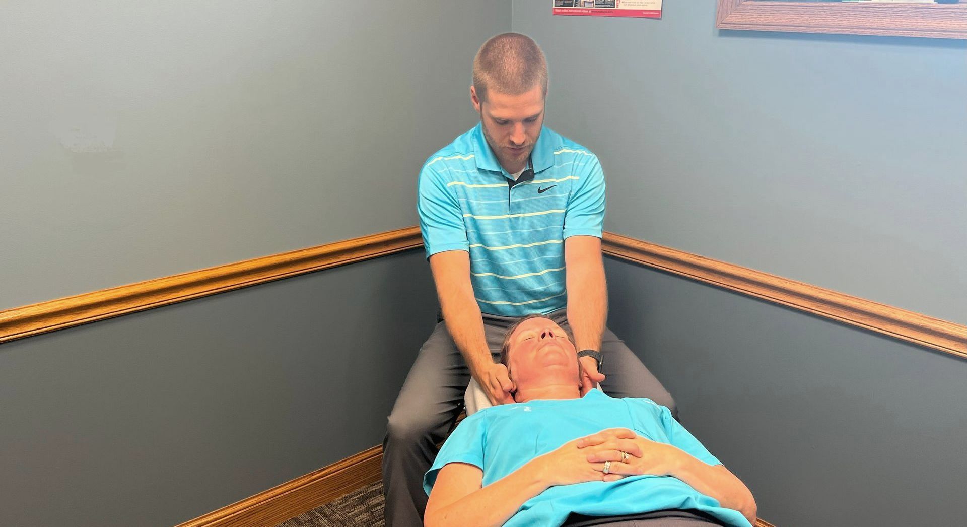 Dr. Zach Klausing Caring for Patient