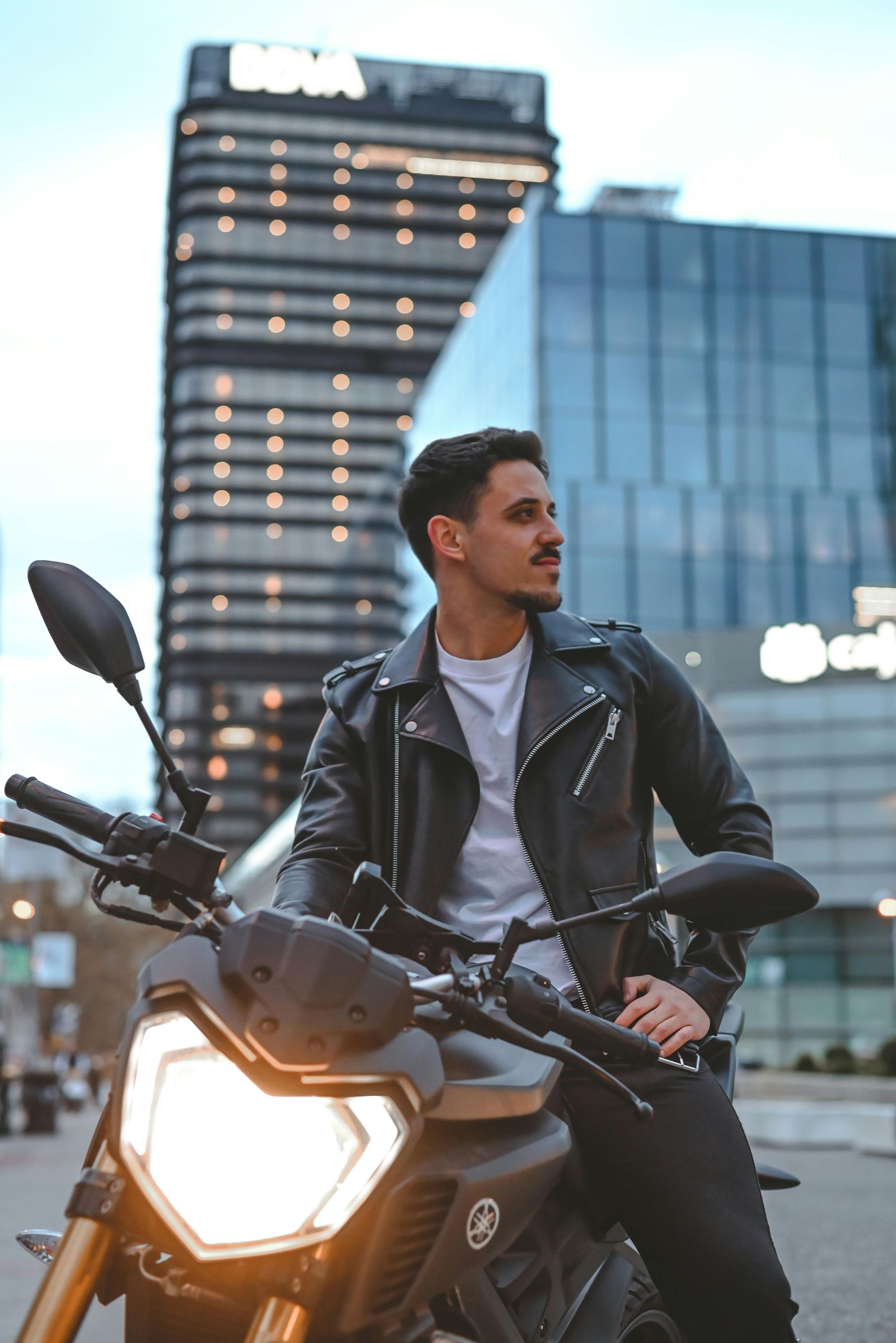 A man sitting on a motorcycle