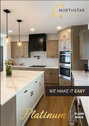 Modern kitchen with white island, light wood cabinets, black range hood, and pendant lights; Northstar branding.