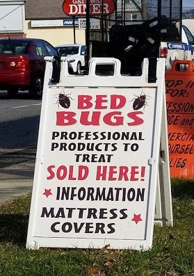 White sandwich board sign: 