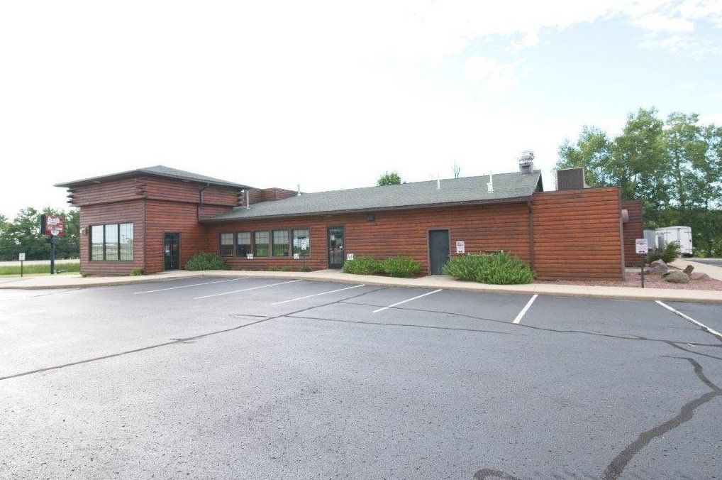 A rec center that has been serviced with parking lot repair, asphalt crack repair, and sealcoating service.