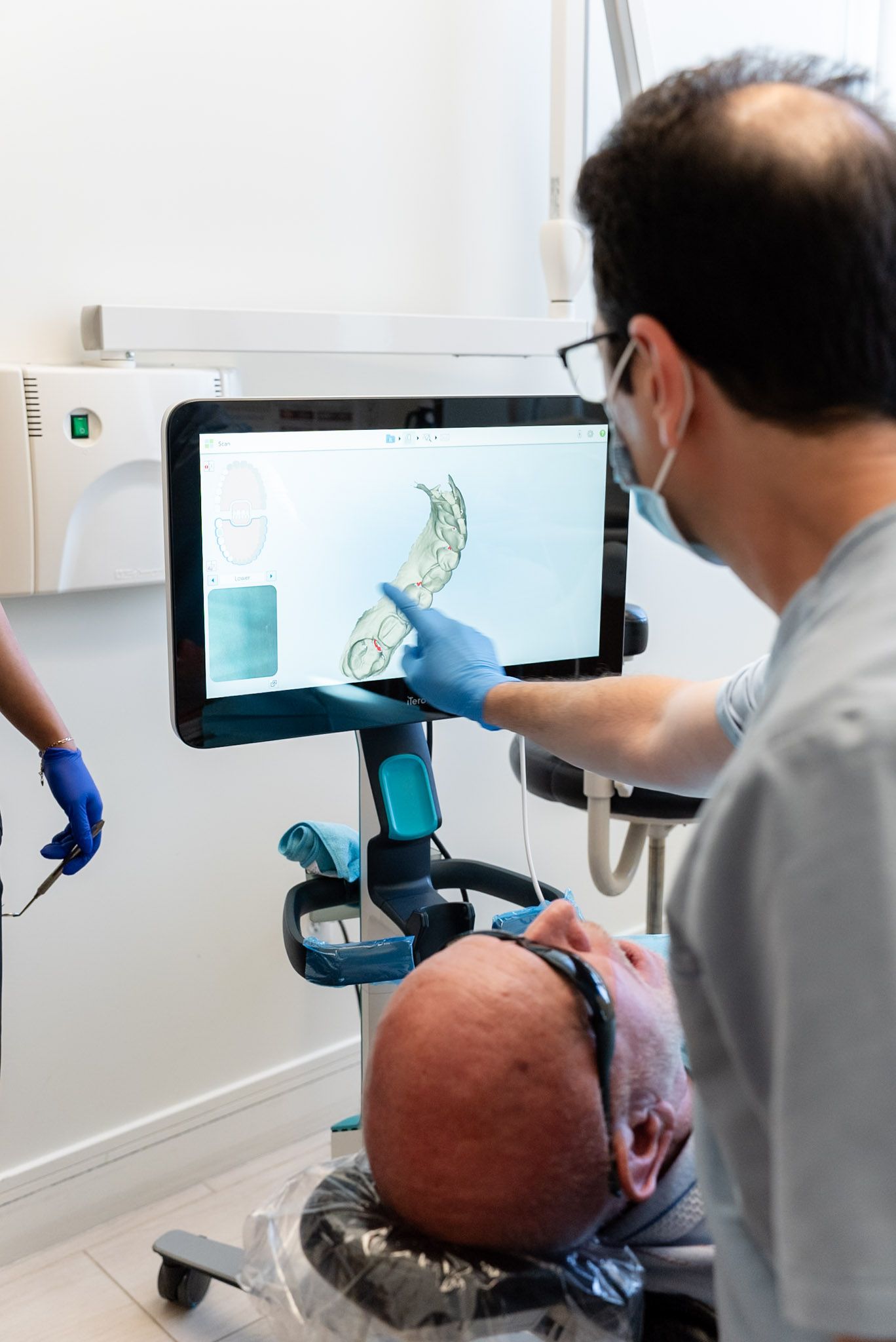 Dr. Shelyan reviewing a 3D tooth scan at a Los Angeles dental office