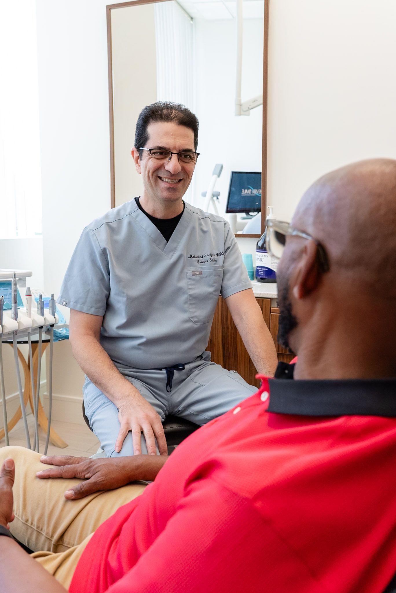 Dr. Shelyan talking a patient through dental implants in Los Angeles, CA