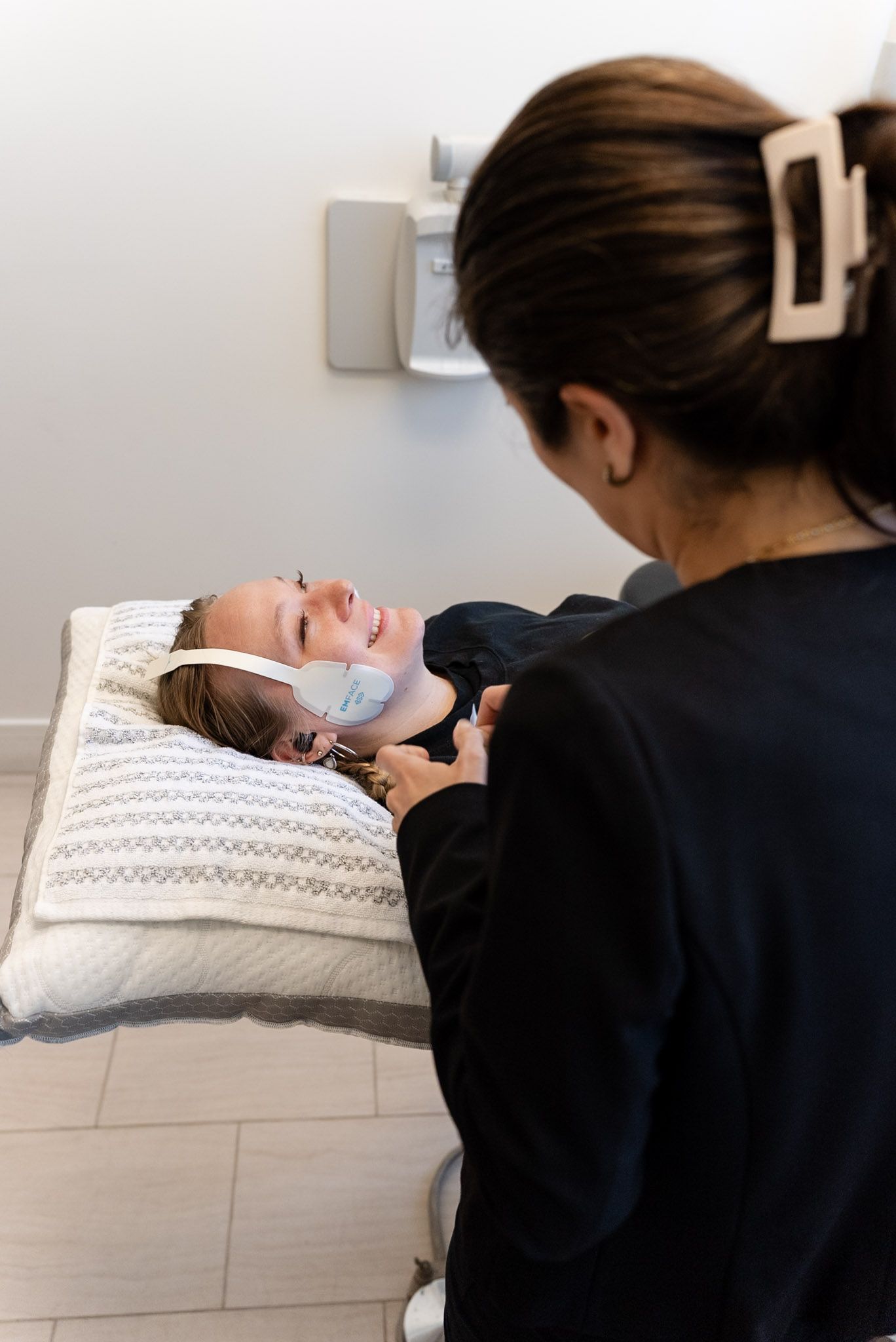 EMFACE TMJ treatment pads being placed at a Los Angeles dental office