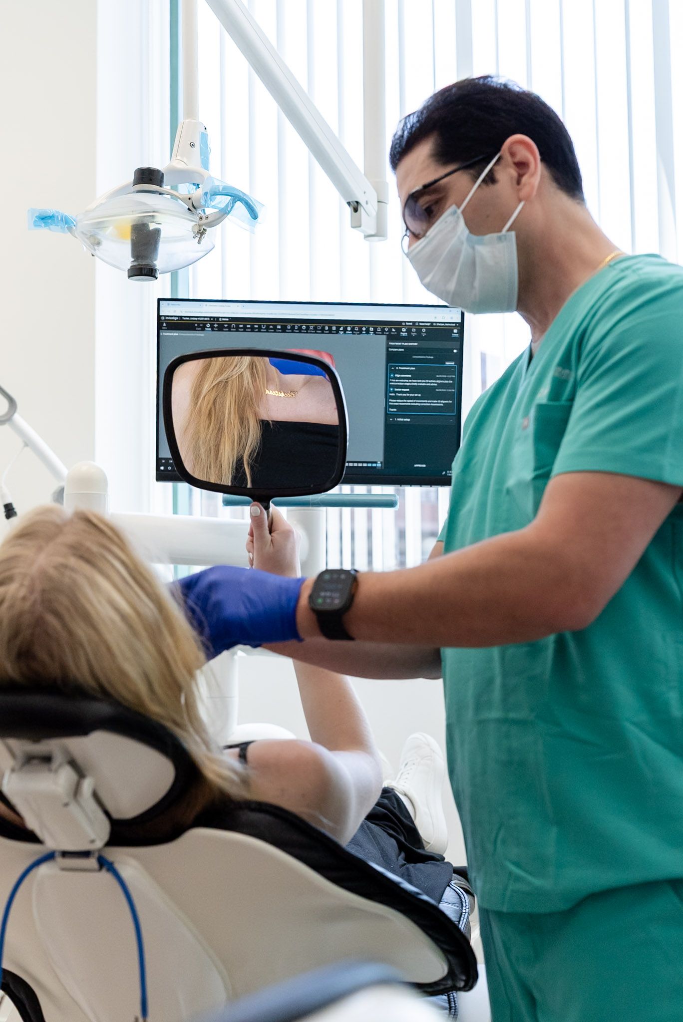 Dr. Shelyan reviewing an intraoral photo with a patient