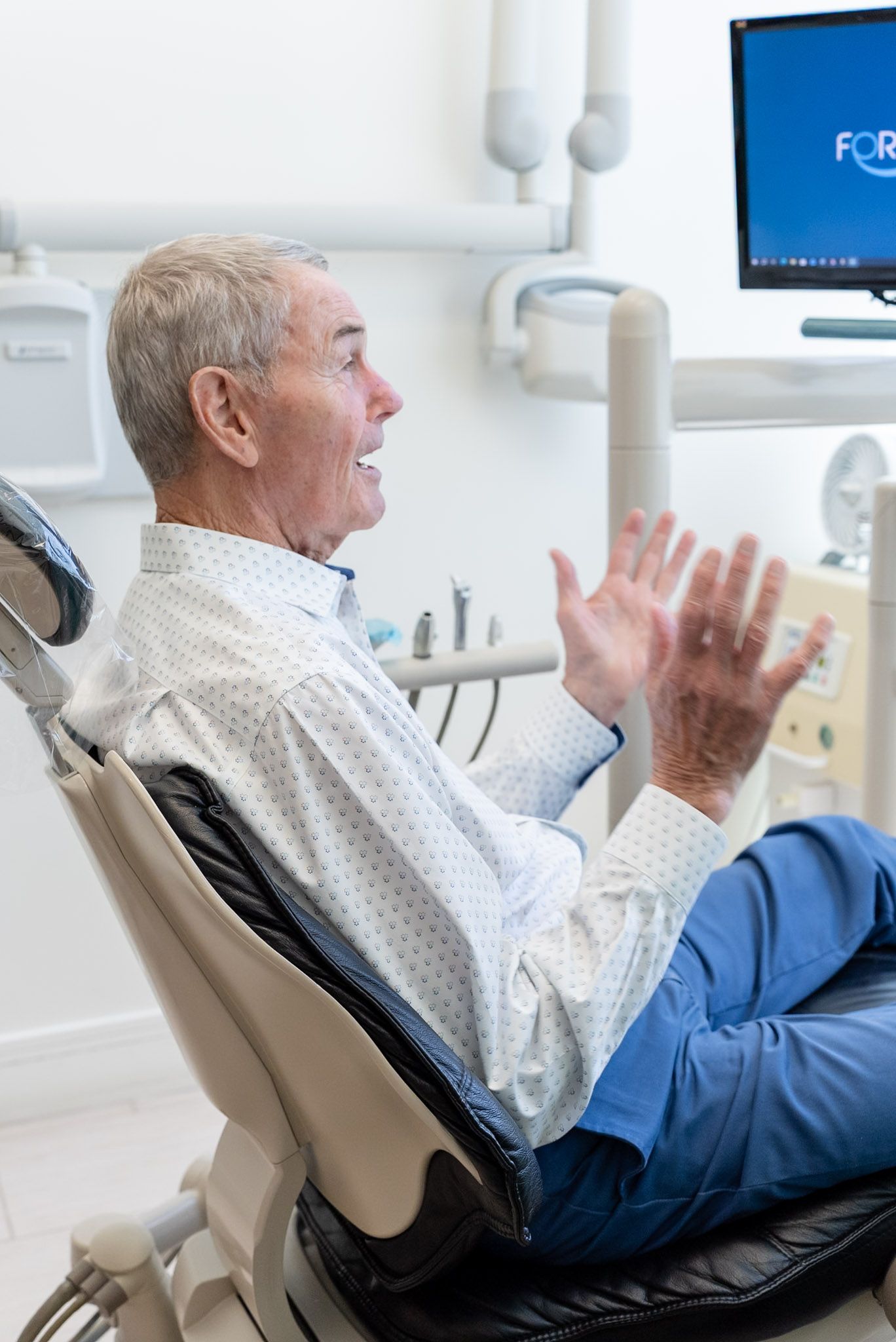 A patient talking through full arch implants at a Los Angeles dental office
