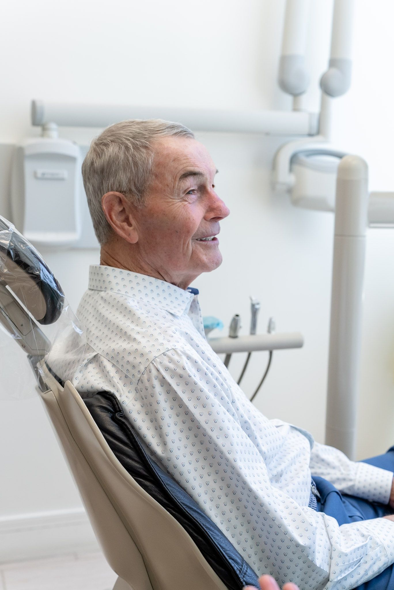 A smiling patient at an implant supported denture visit, Los Angeles dentist
