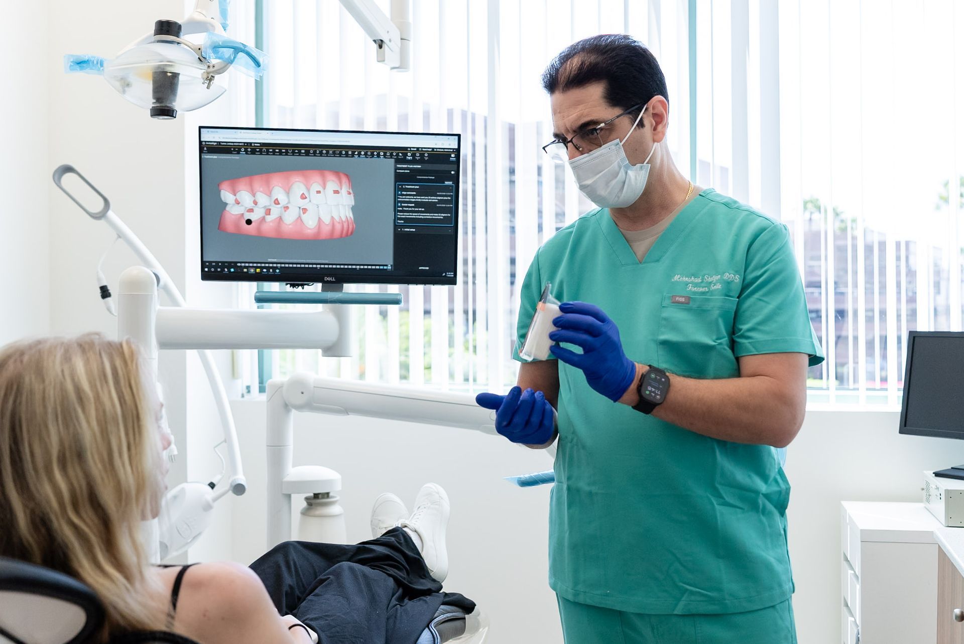 Dr. Shelyan preparing for treatment in a Forever Smile operatory