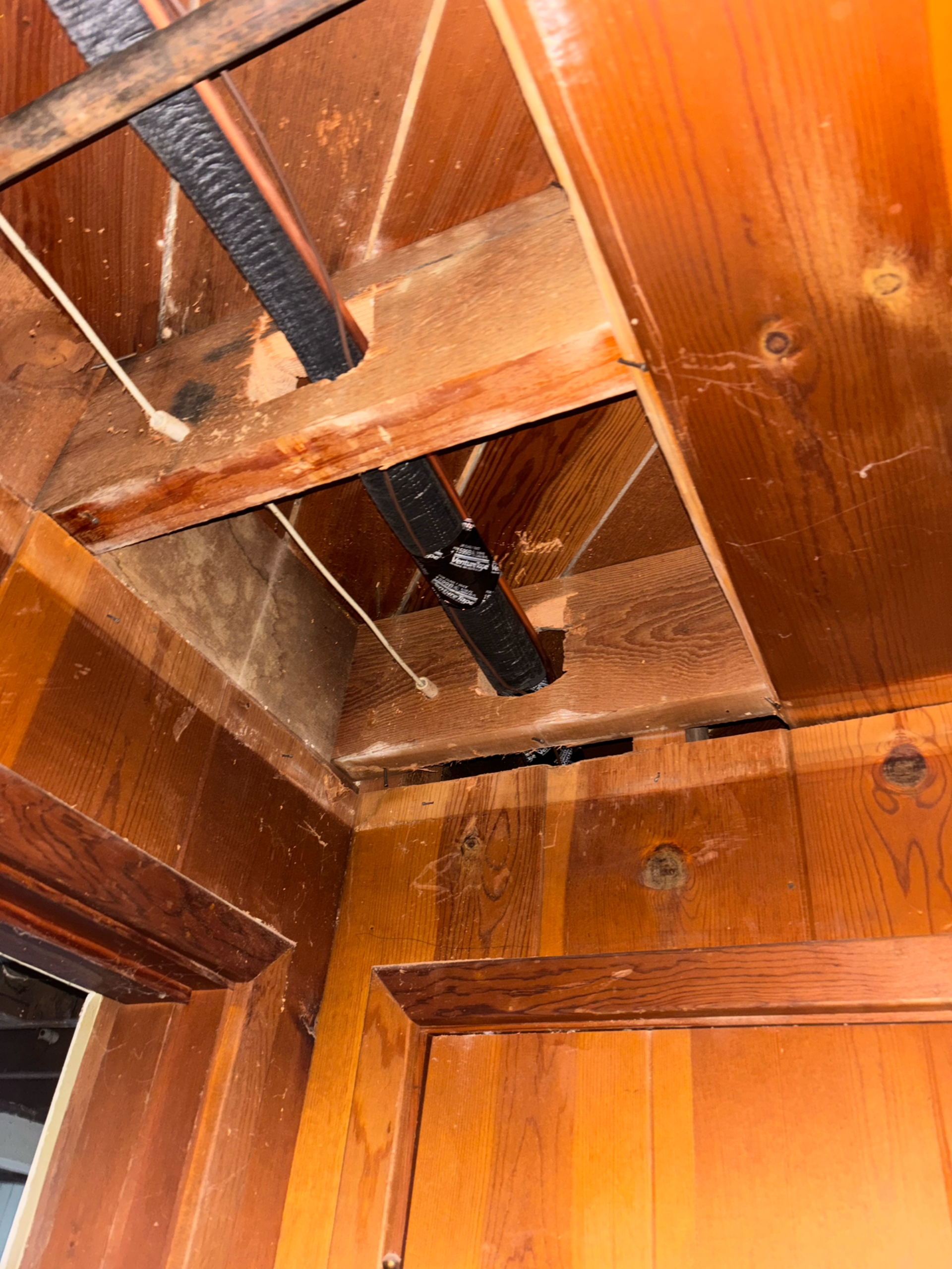 Inside a wooden chest, revealing mechanical components and cedar lining.