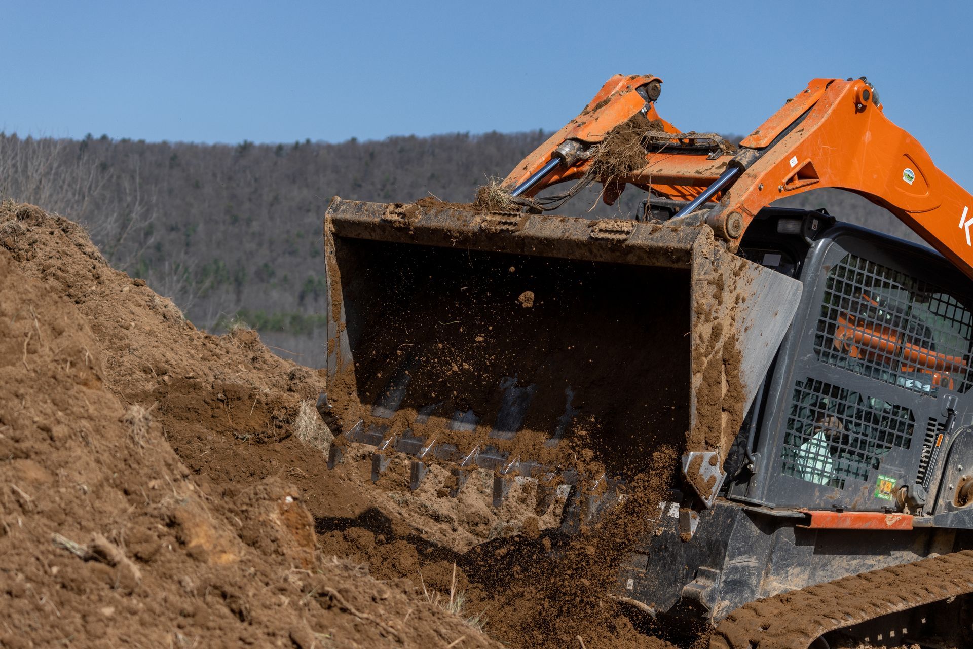 A bulldozer is moving dirt on a construction site