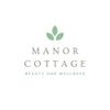 Manor Cottage Beauty and Wellness logo with green leaf icon on a white background