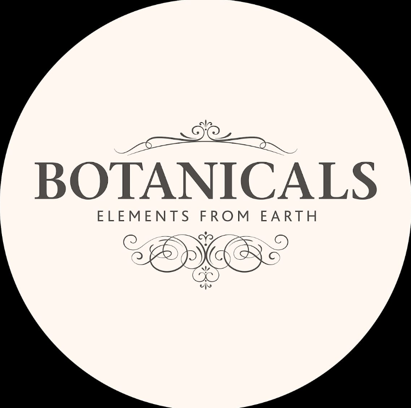 Circular beige logo reading “BOTANICALS” with “ELEMENTS FROM EARTH” and decorative flourishes