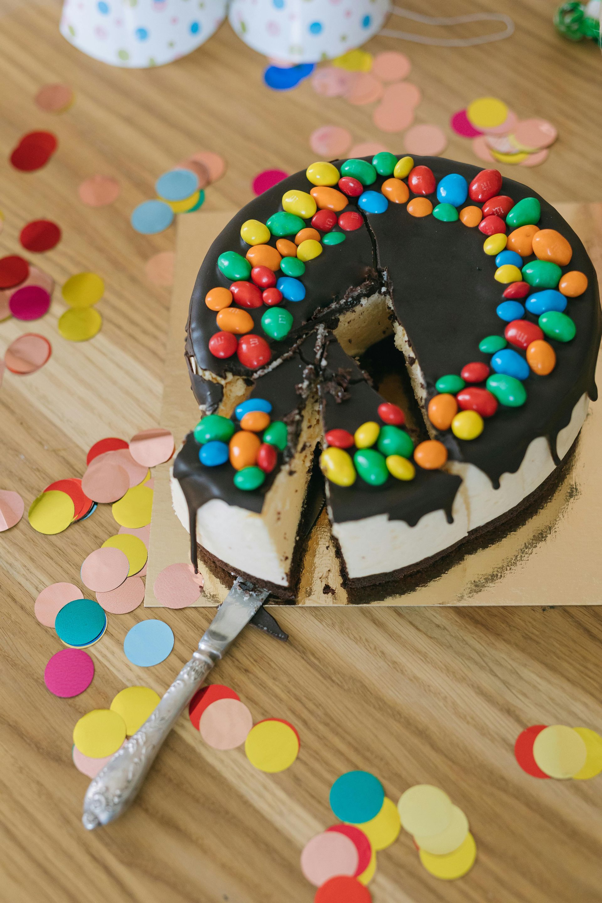 A birthday cake with a slice taken out of it