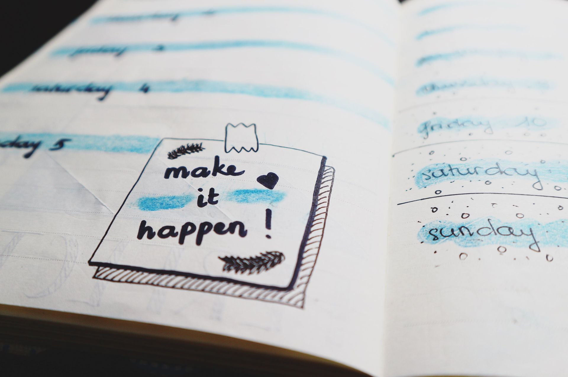 A motivational quote written on a notebook.